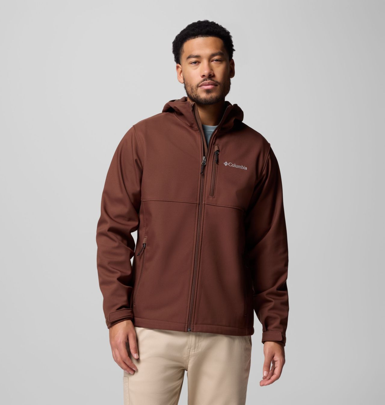 A model wearing the Columbia men's Ascender II Hooded Softshell Jacket in Delta.